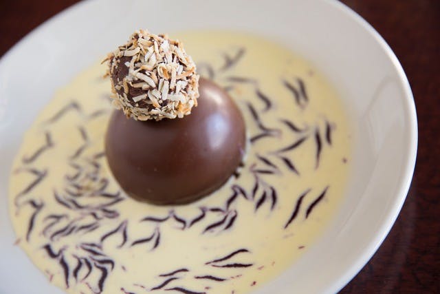 a close up of a plate covered with chocolate