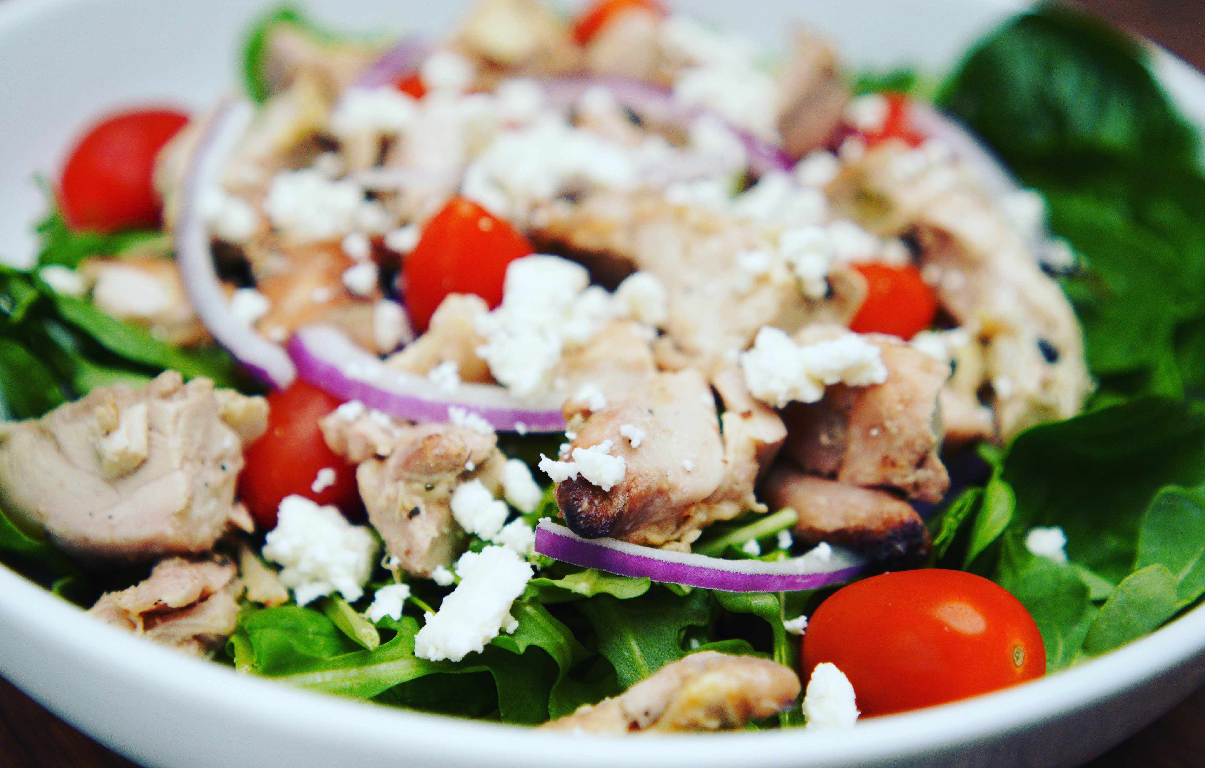 a salad with tomatoes and cheese