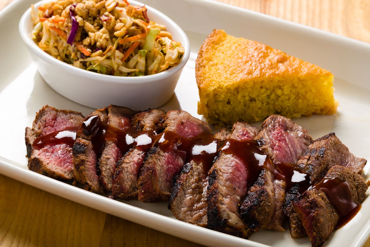 steak slices with corn bread and coleslaw