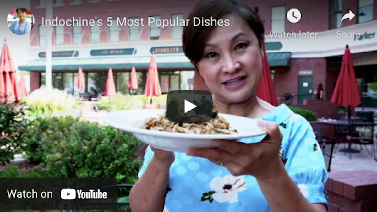 a person holding a plate of food