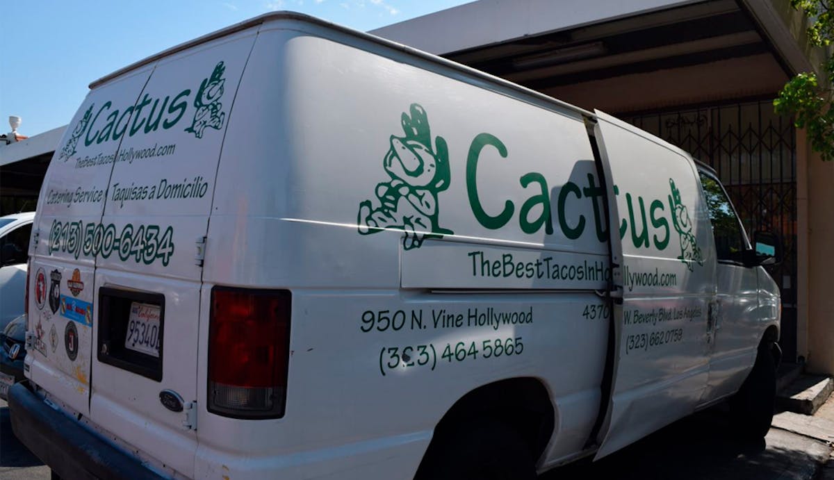 a van parked on the side of a building