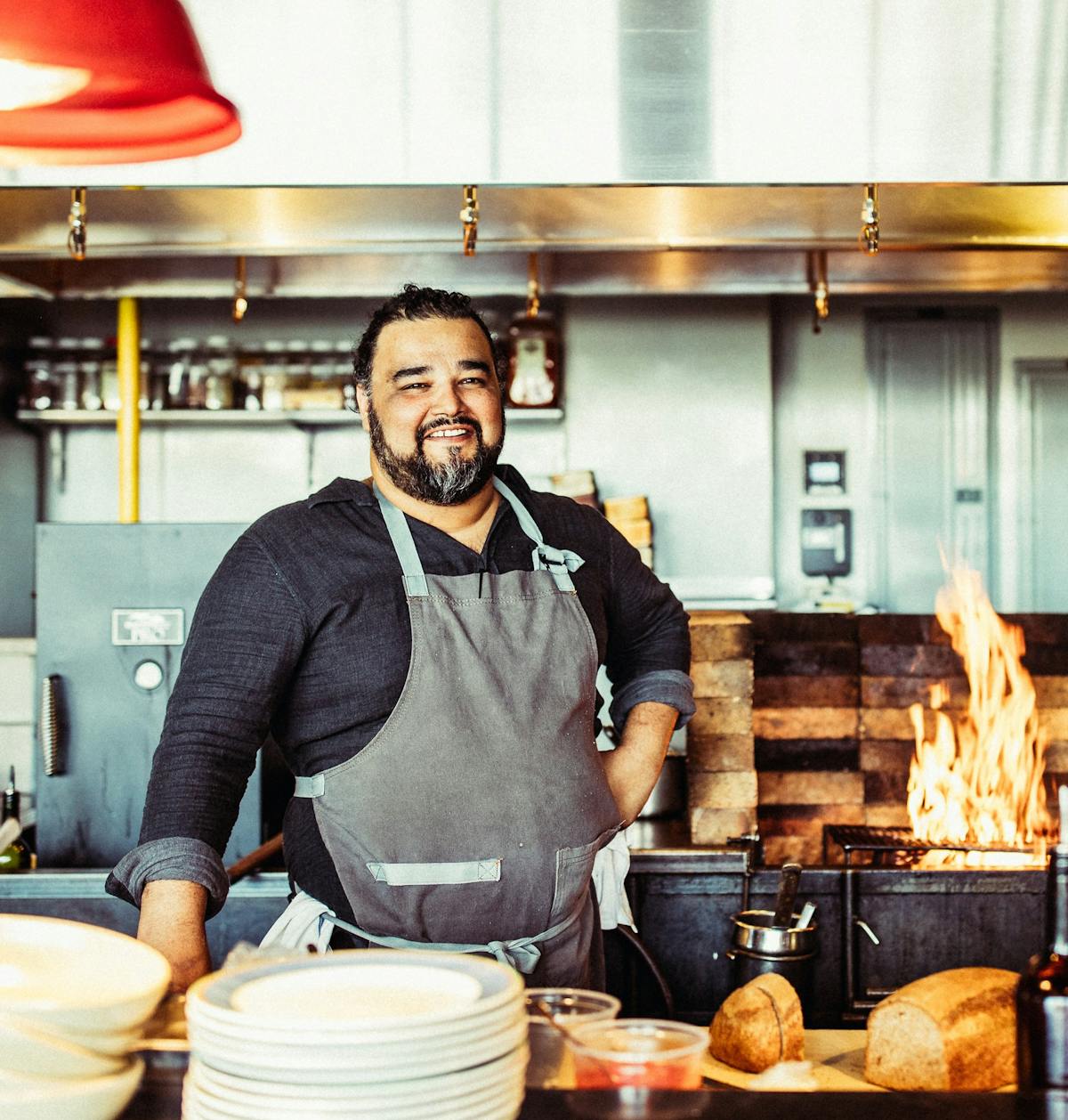 a person cooking food in a kitchen