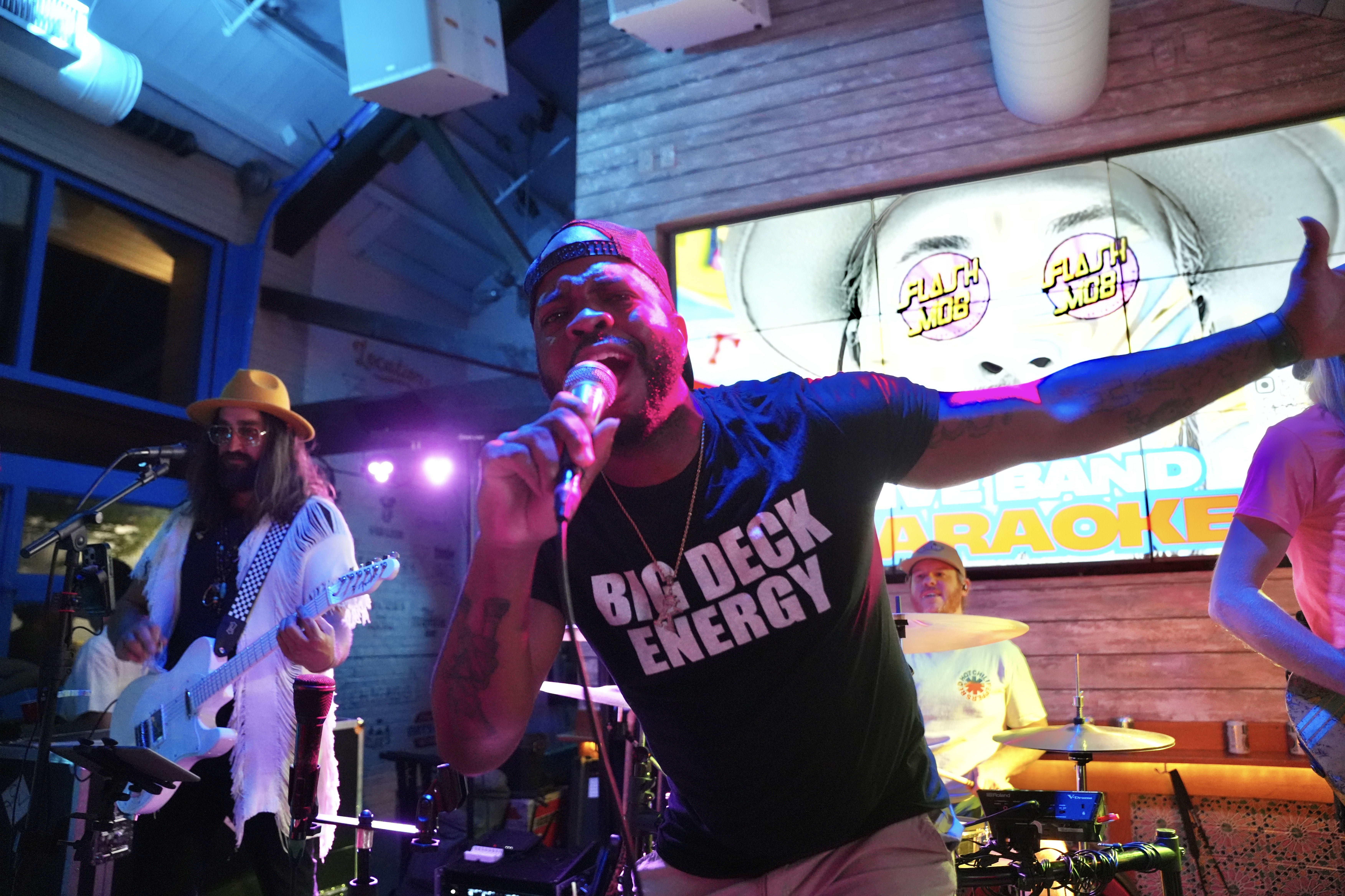 a man singing louder