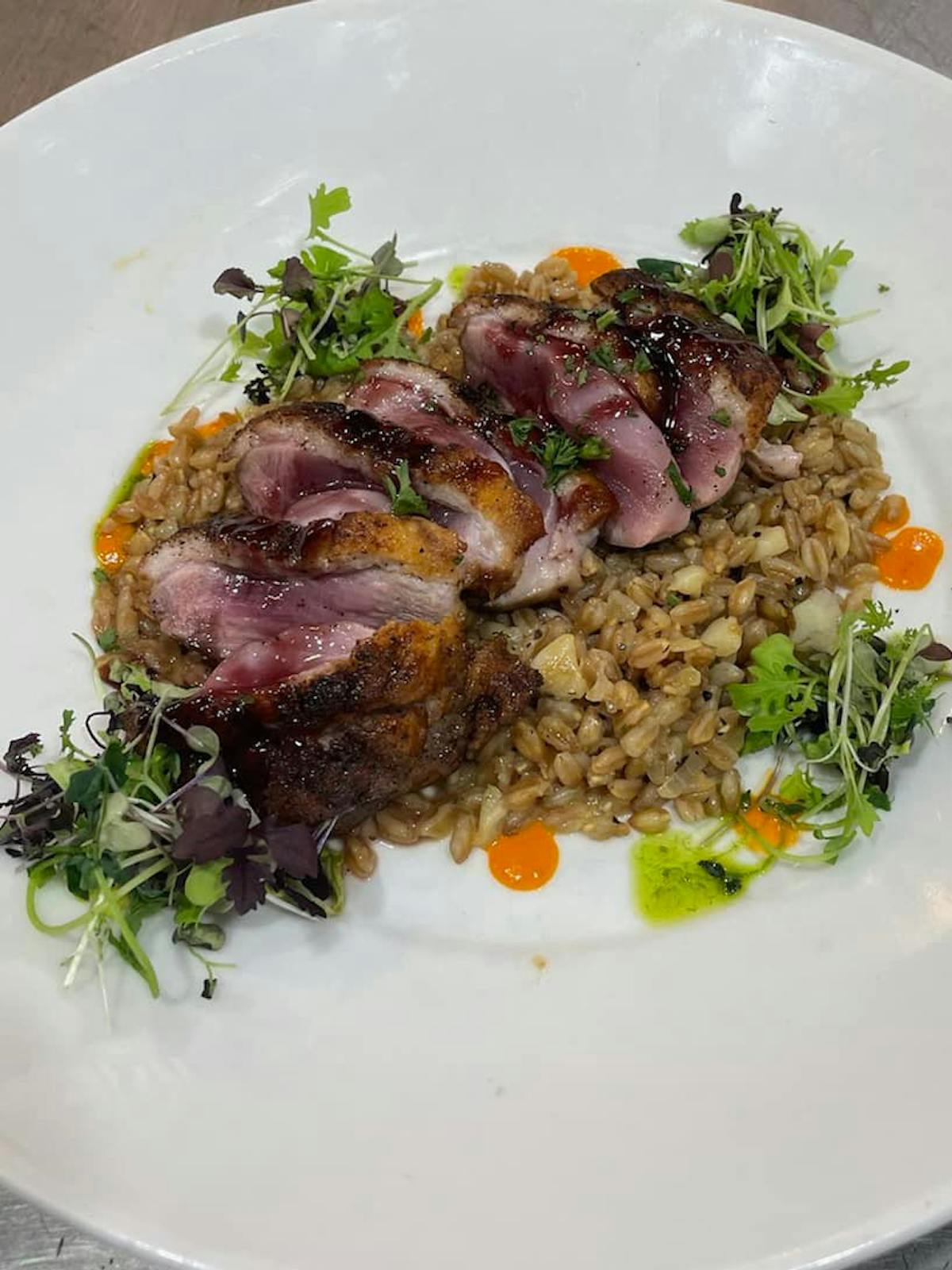 a plate of food with rice meat and vegetables
