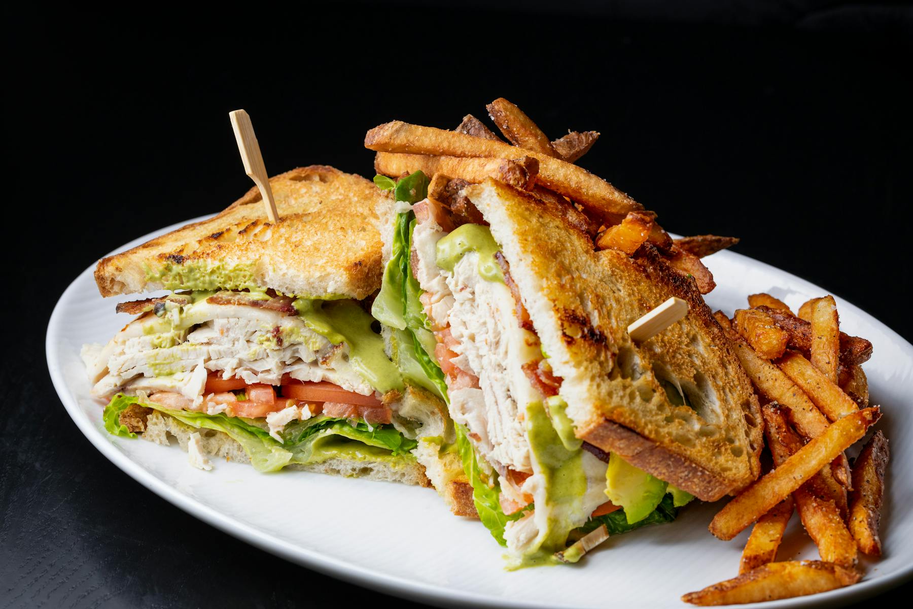 a sandwich and fries on a plate