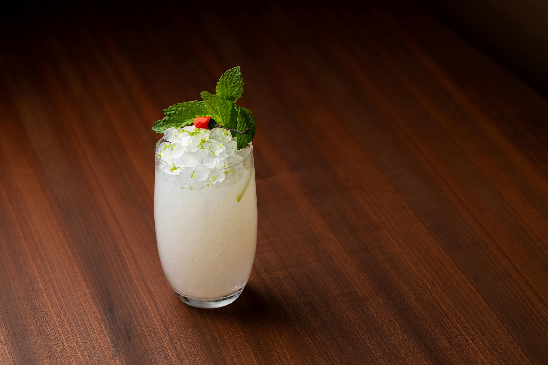 a cocktail on a wooden table