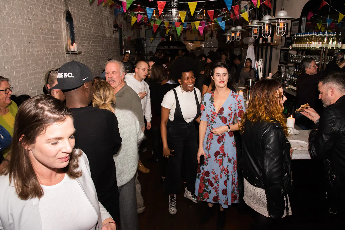 a group of people standing in front of a crowd