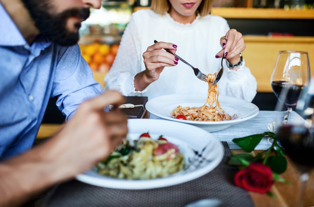 people eating pasta at an Italian restaurant