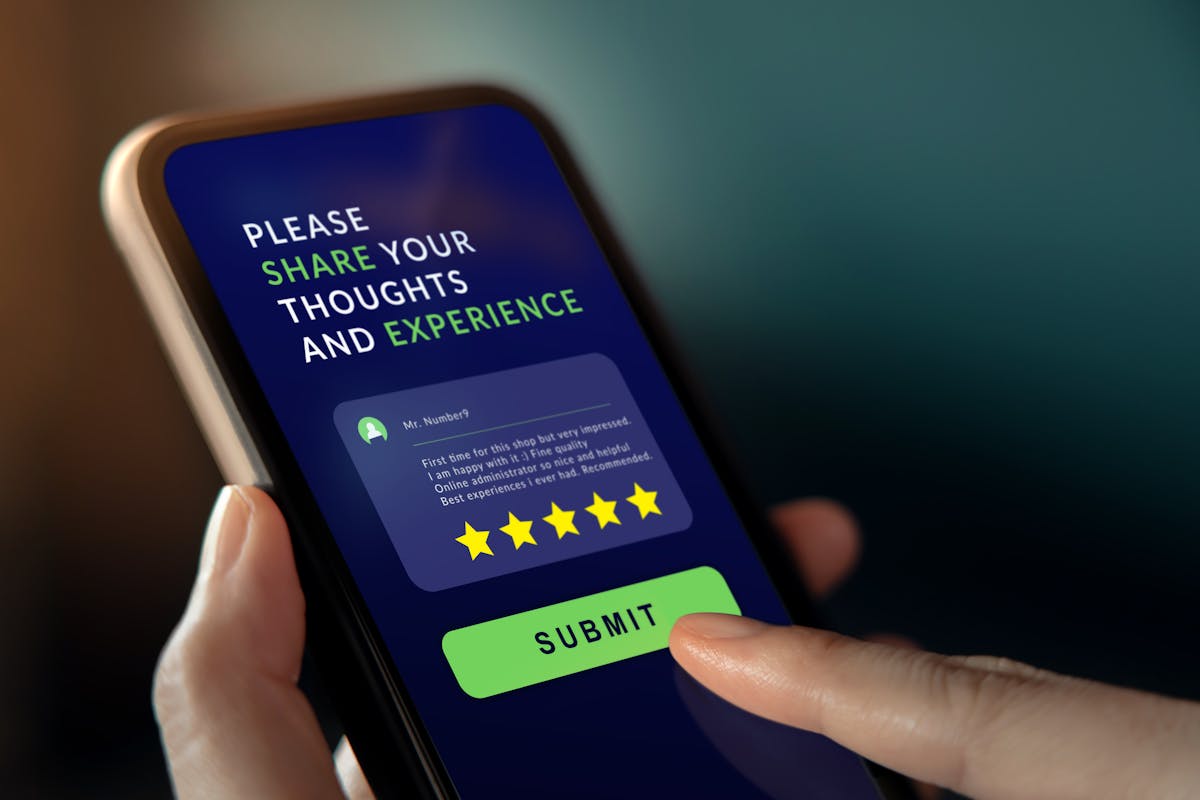 a hand holding a cell phone screen with text