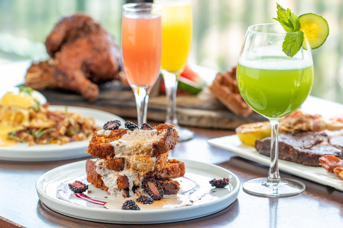 mother's day brunch items, french toast pictured with mimosas