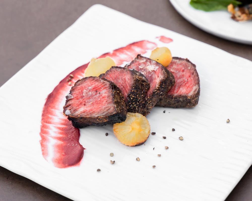 a plate of food with a slice cut out