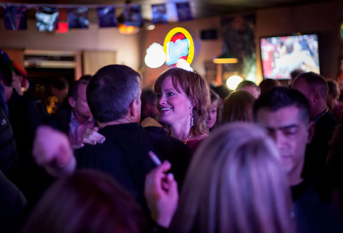 a group of people standing in front of a crowd
