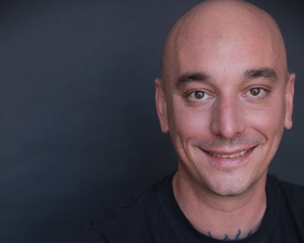 a man smiling for the camera