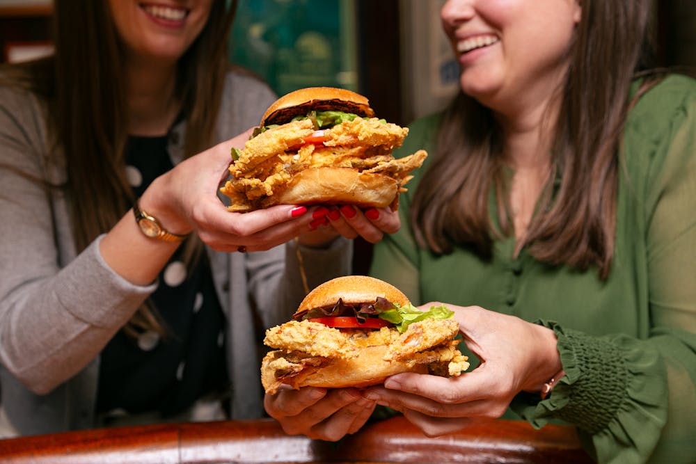 a plate of food that is on the side of fries