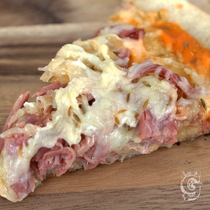 a close up of a slice of pizza