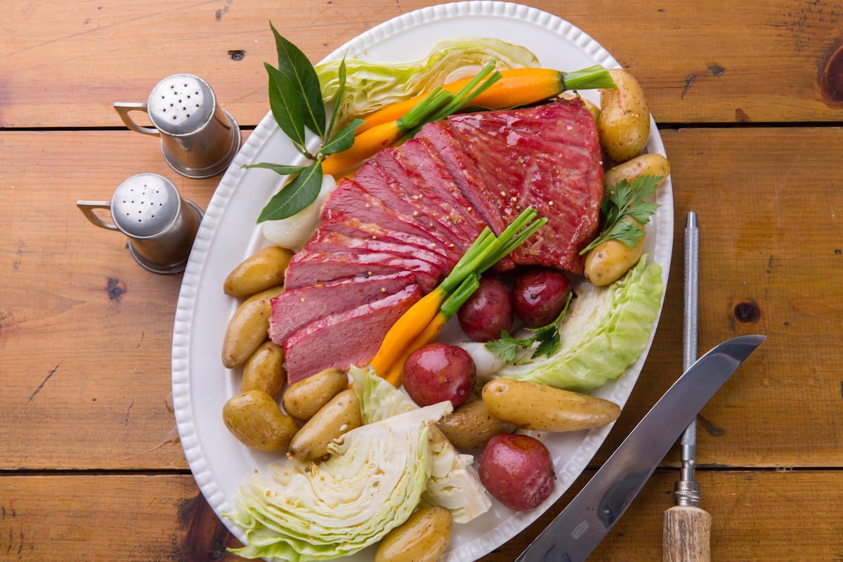 a plate of food sitting on top of a wooden table