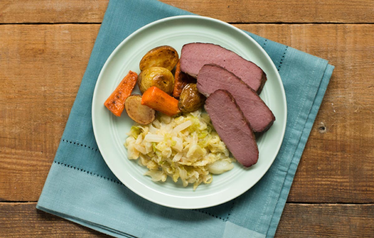 a plate of food sitting on top of a wooden table