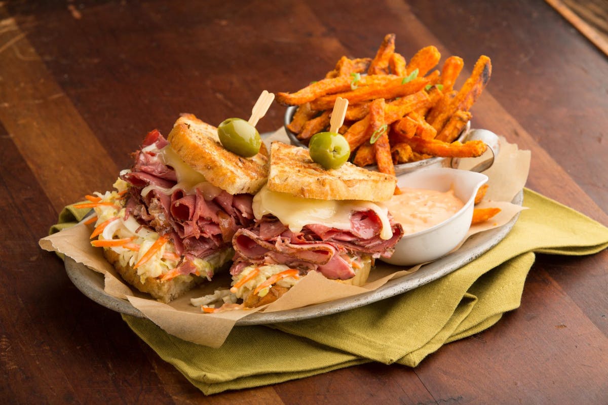 a sandwich sitting on top of a wooden table