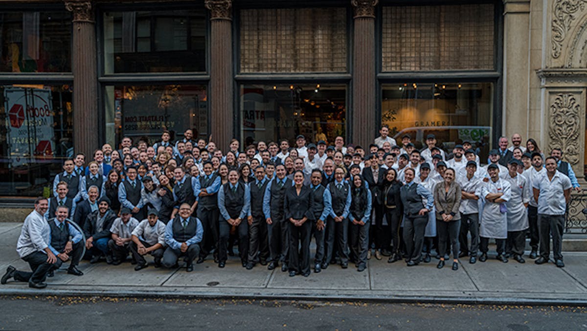a group of people standing in front of a crowd