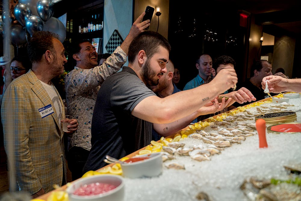 a man cutting a cake