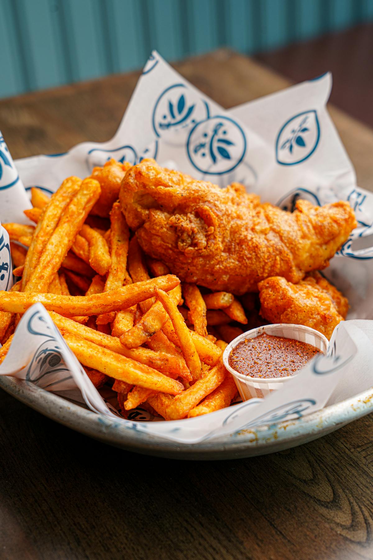 a plate with a sandwich and fries on a table