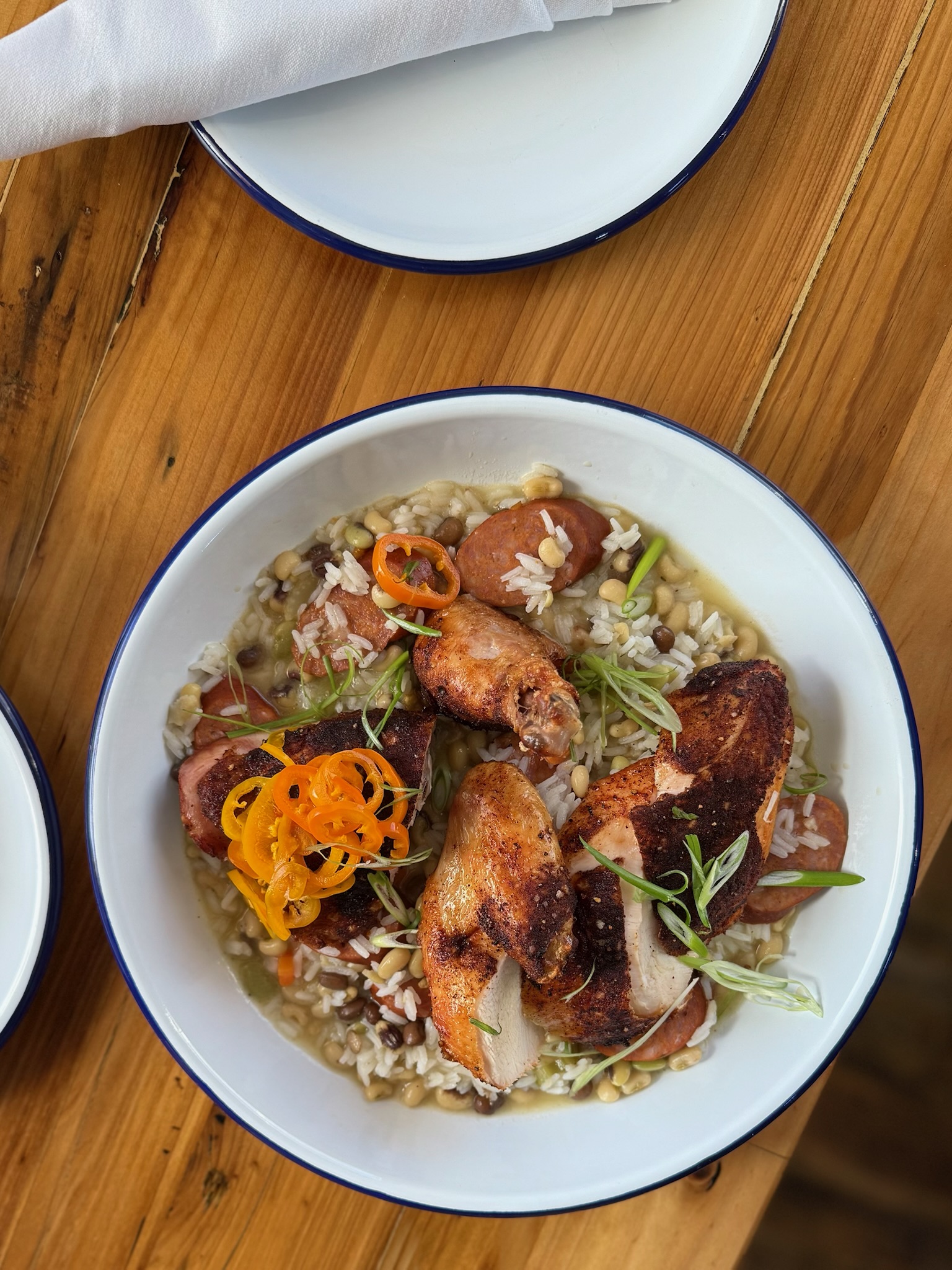 a plate of food sitting on top of a wooden table