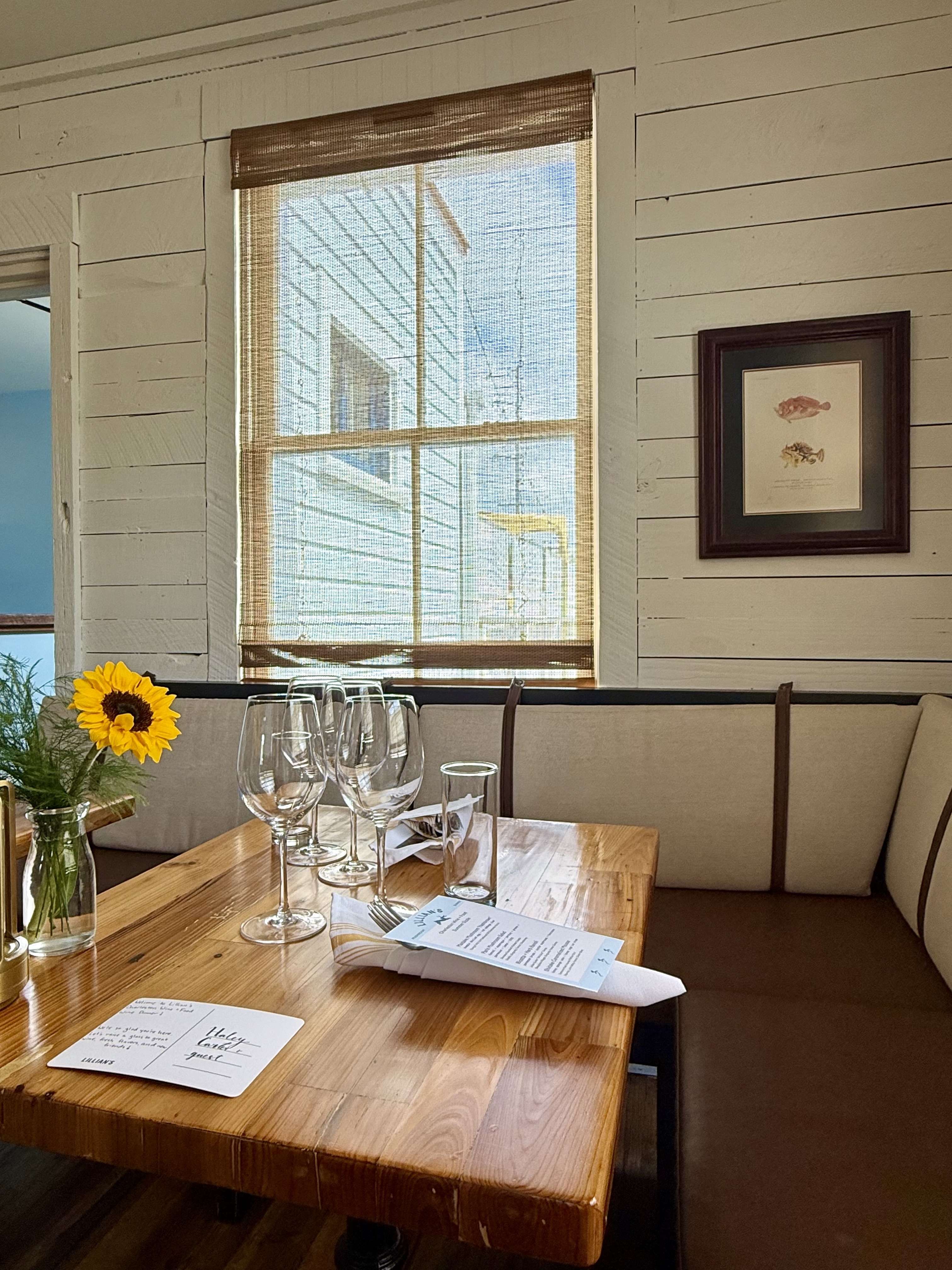 a dining room table in front of a window