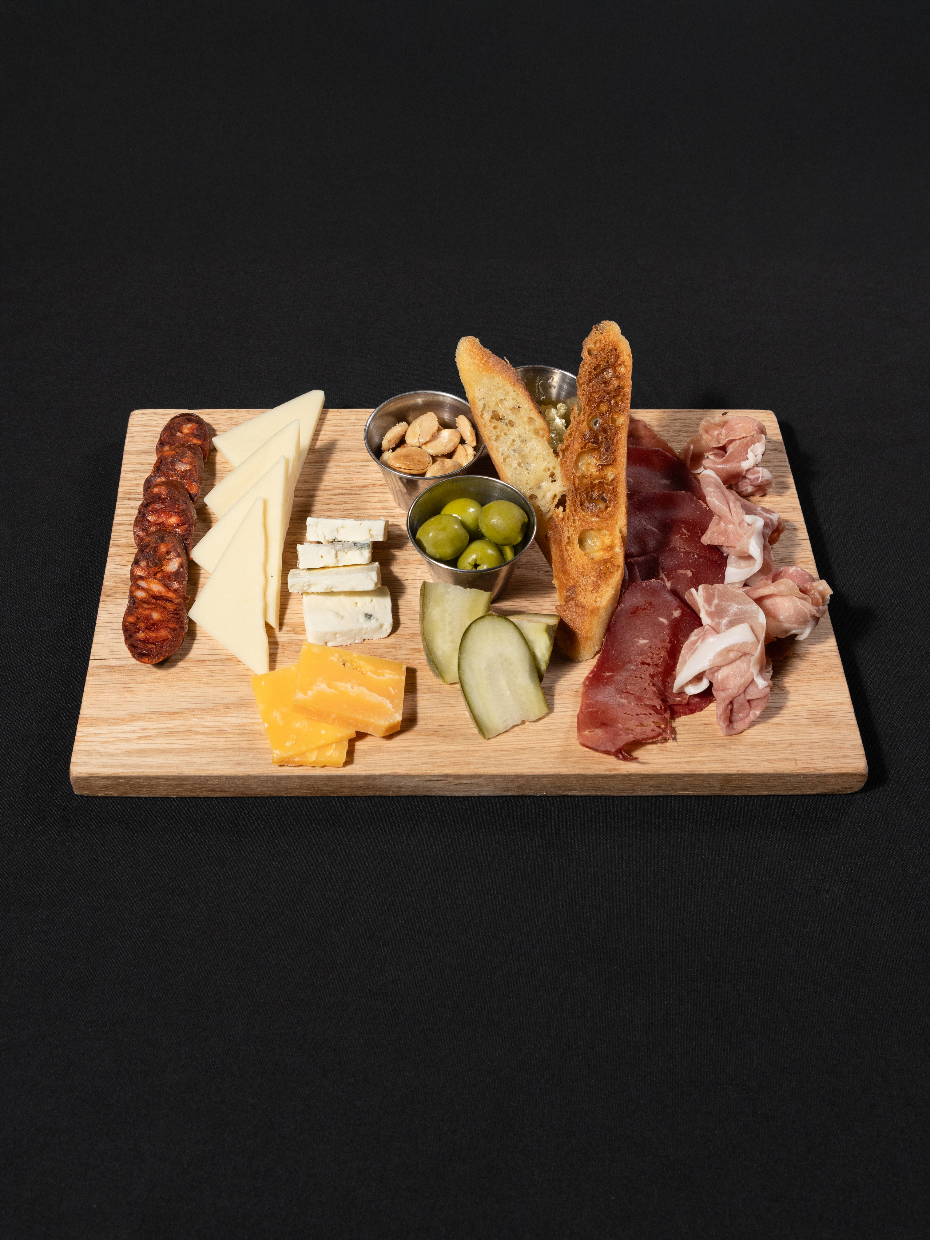 a board with different types of food on it