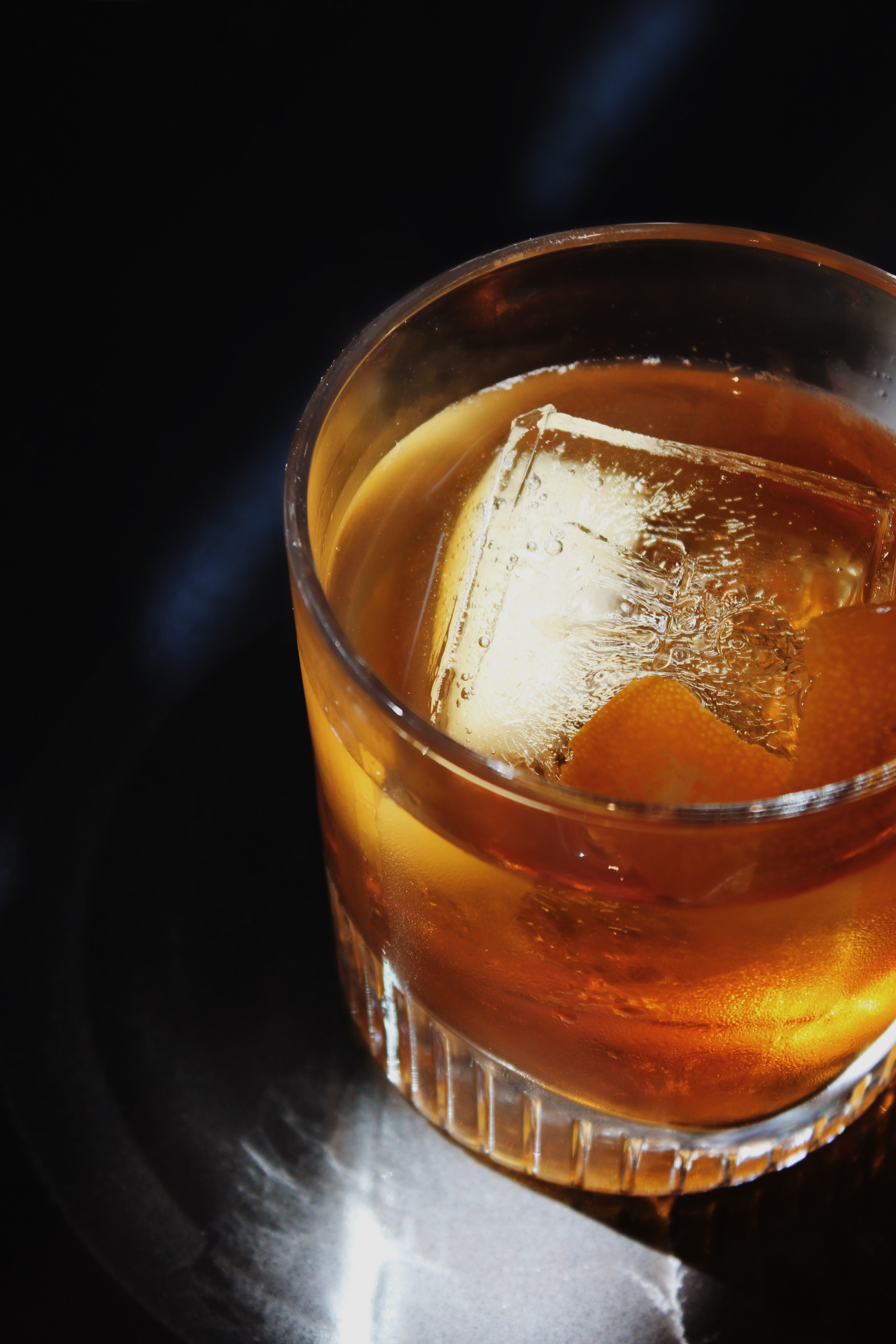 a glass with a drink and ice
