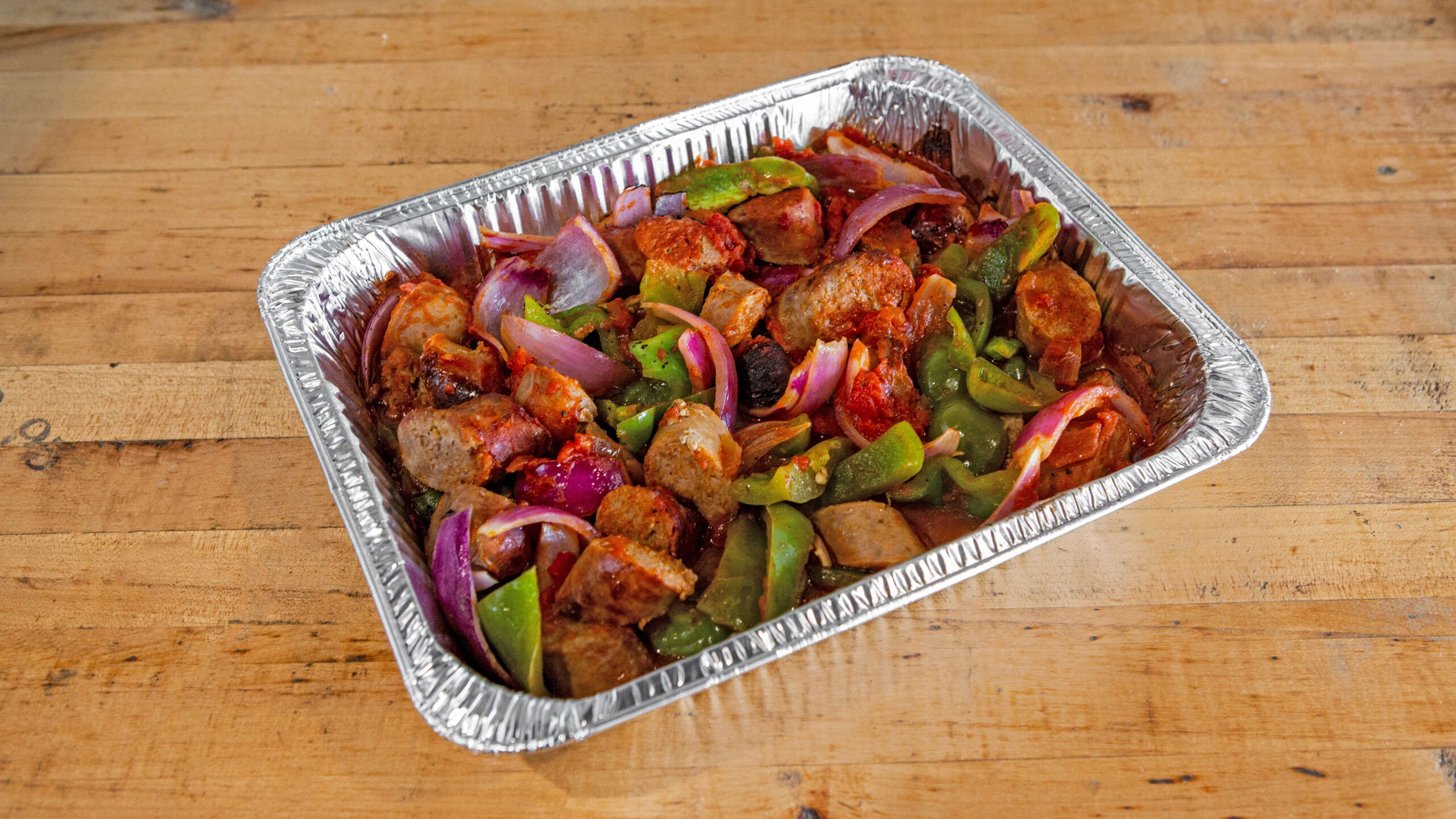 a tray full of food sitting on top of a wooden table