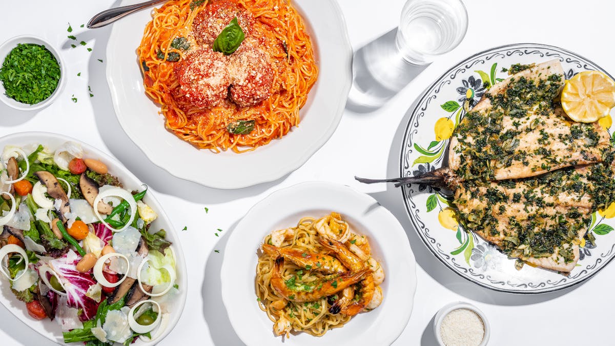 a white plate topped with different types of food on a table