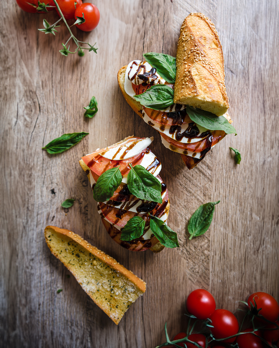 a sandwich sitting on top of a wooden cutting board
