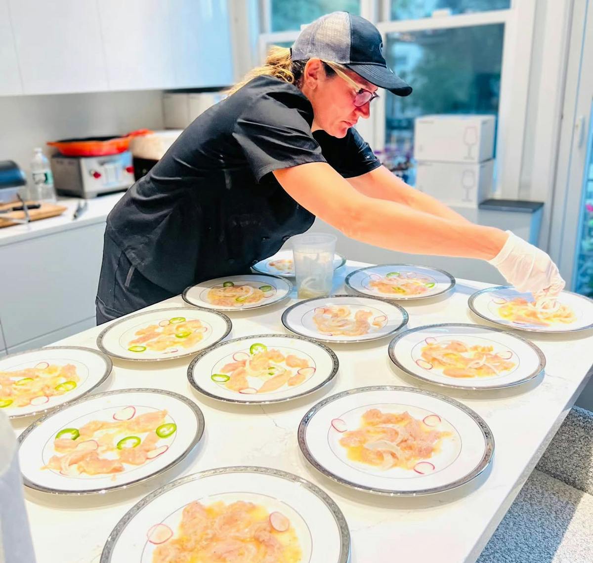 a man sitting at a table with a plate of food