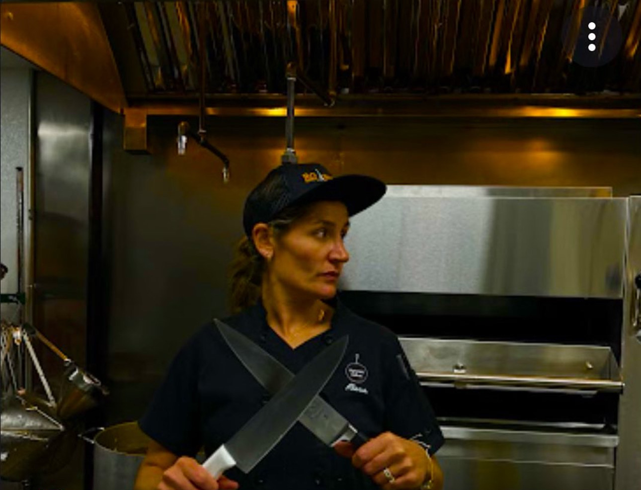 a person standing in a kitchen