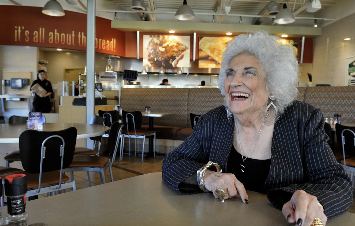 Susana Walton sitting at a table in a restaurant
