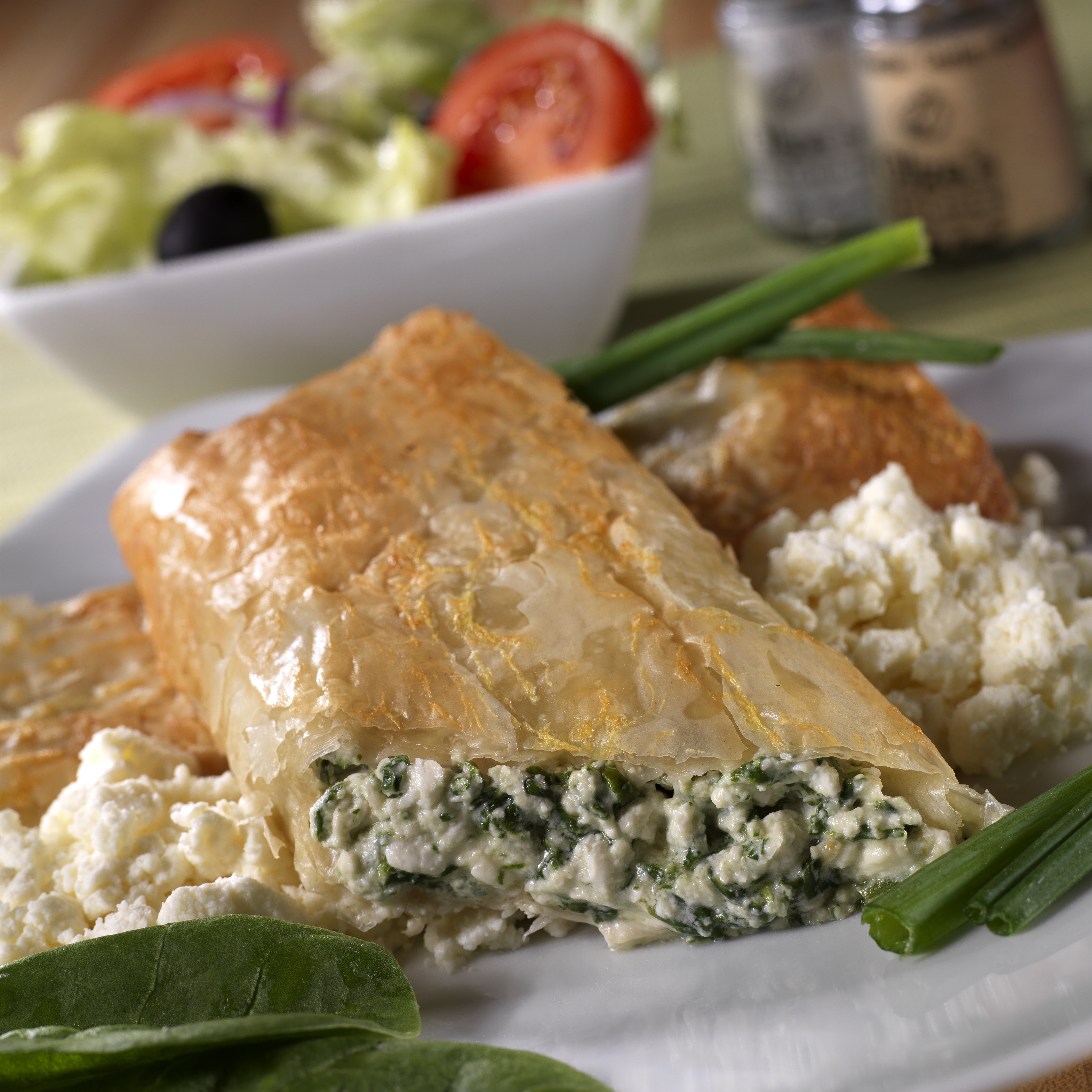 a plate of food with a bowl of salad