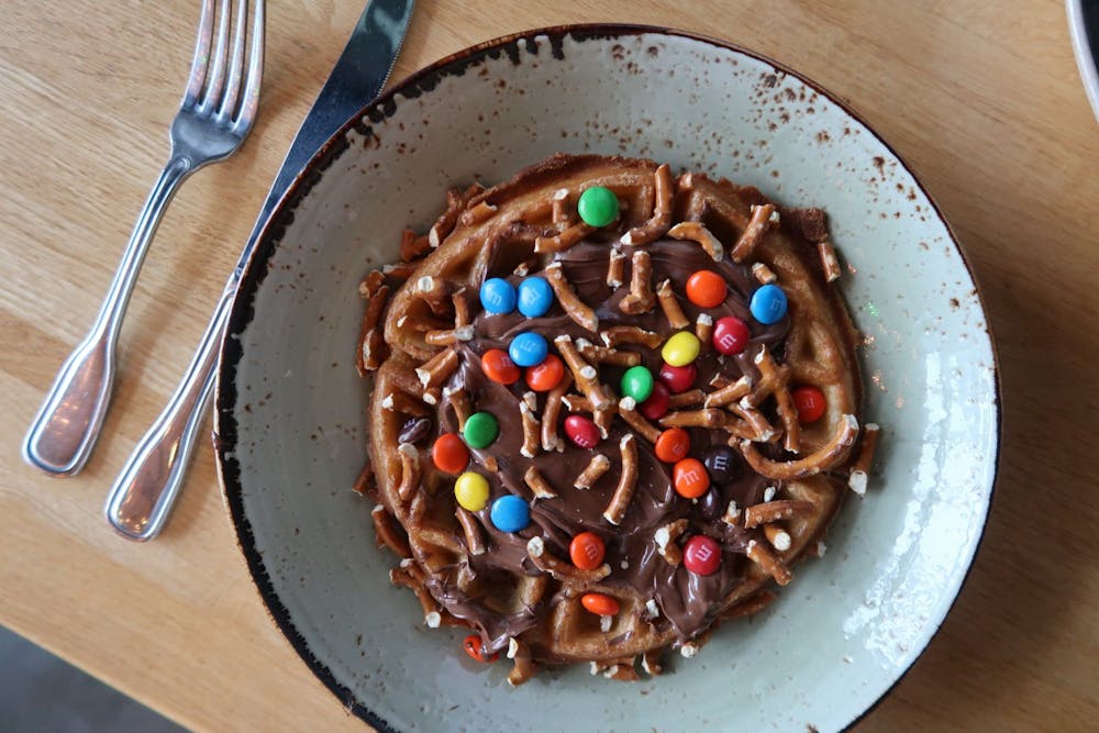 a plate of food sitting on top of a wooden table