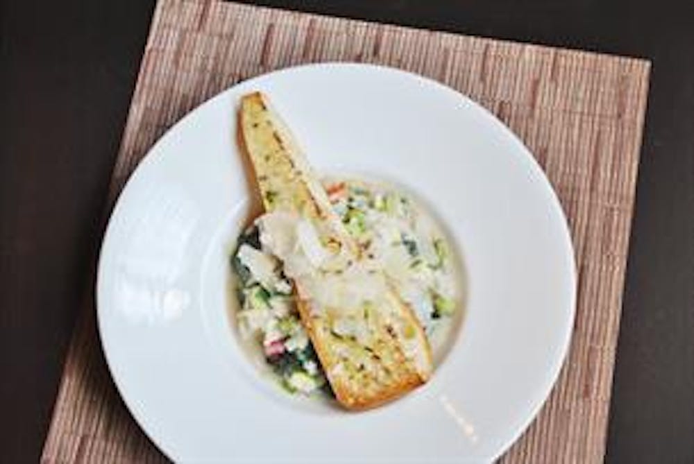 a plate of food sitting on top of a wooden table