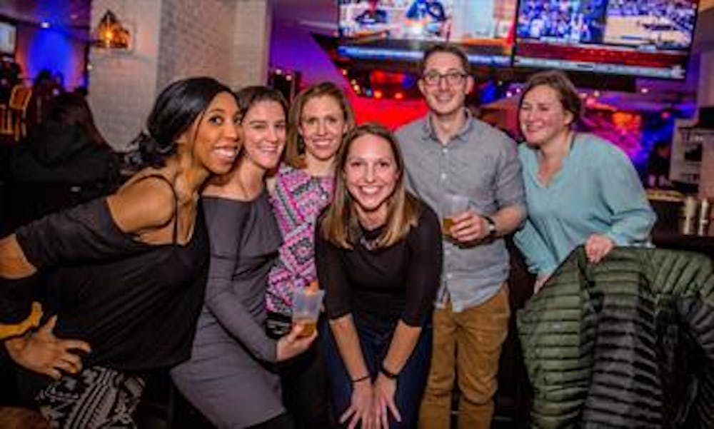 a group of people posing for the camera