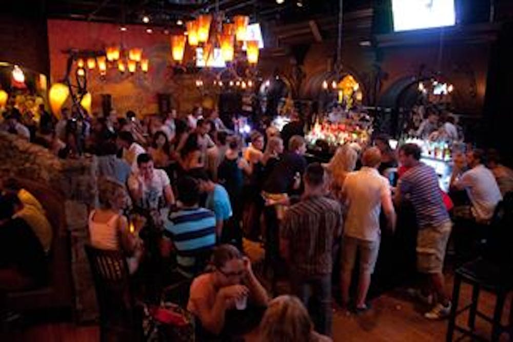 a group of people sitting at a table in front of a crowd