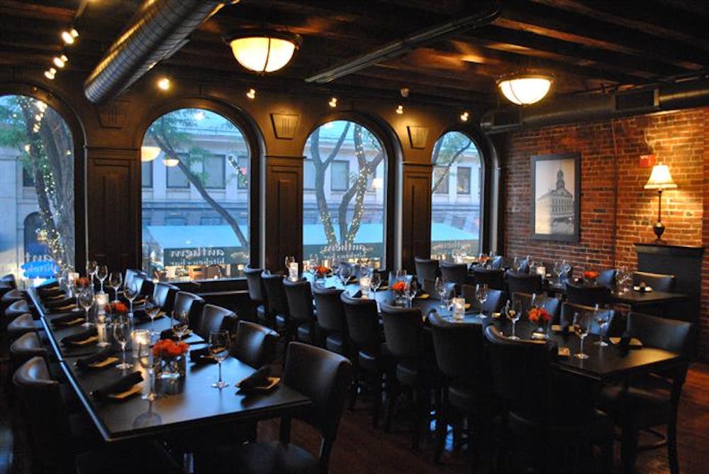 a dining room table in front of a window