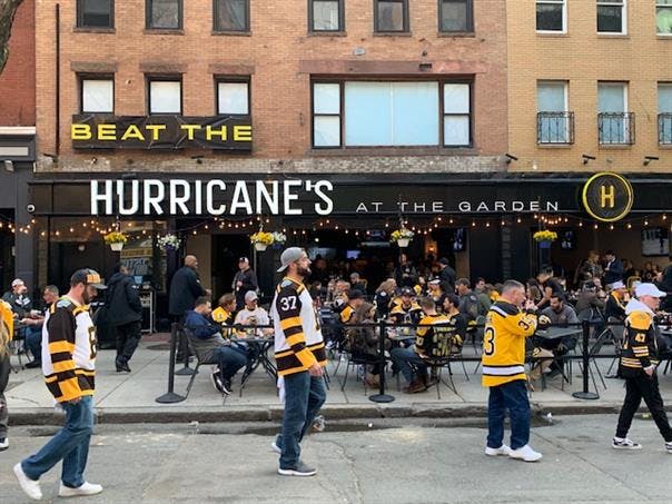 a group of people walking in front of a building