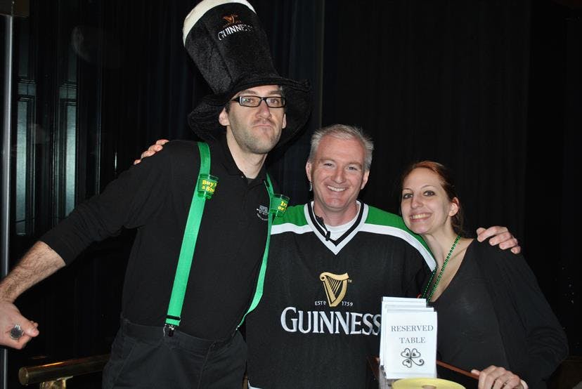 Dickie Moore holding a sign posing for the camera