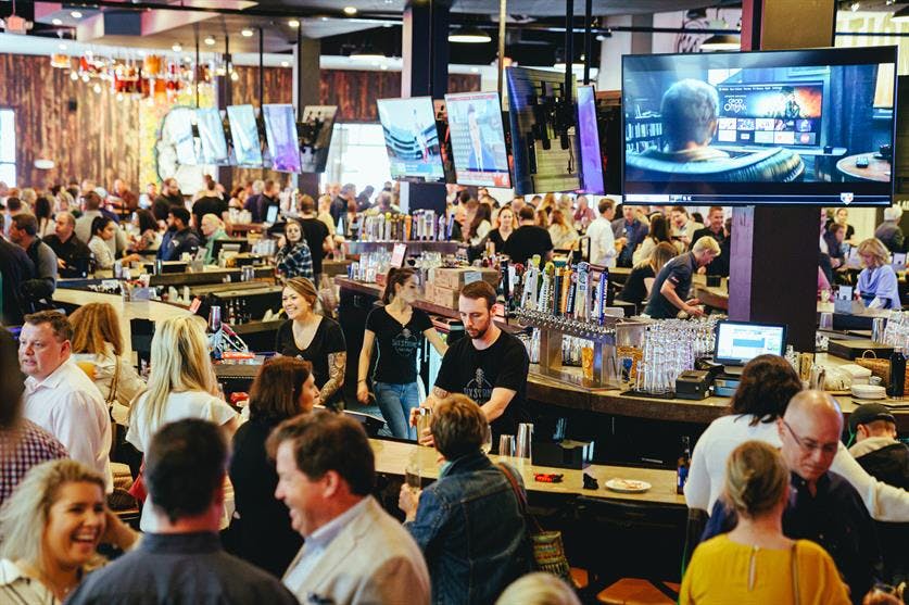 a group of people sitting at tables