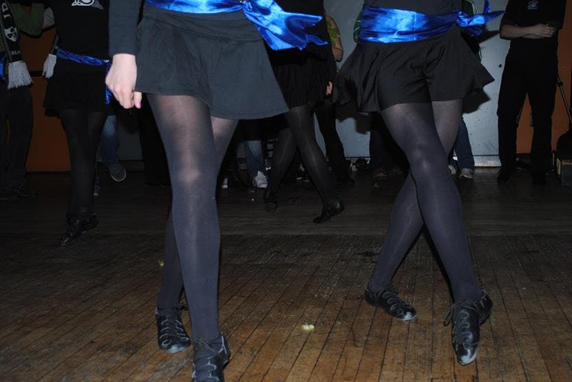 a group of people standing on the floor