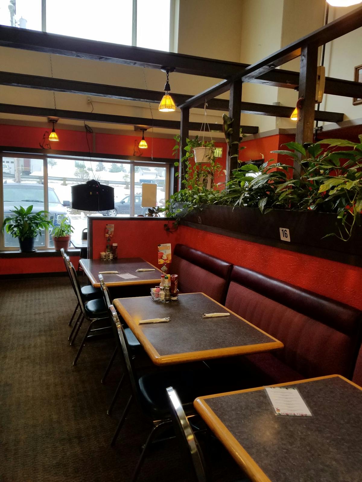 An interior of Pizza Express with tables and booth