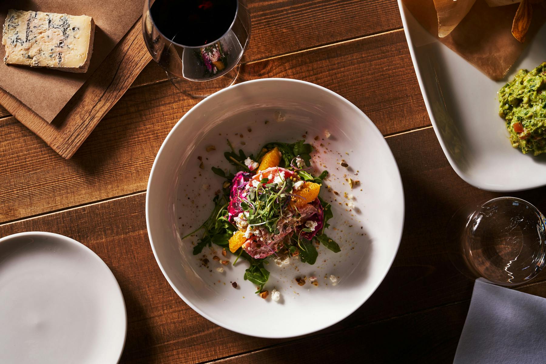 a bowl of food on a plate on a table