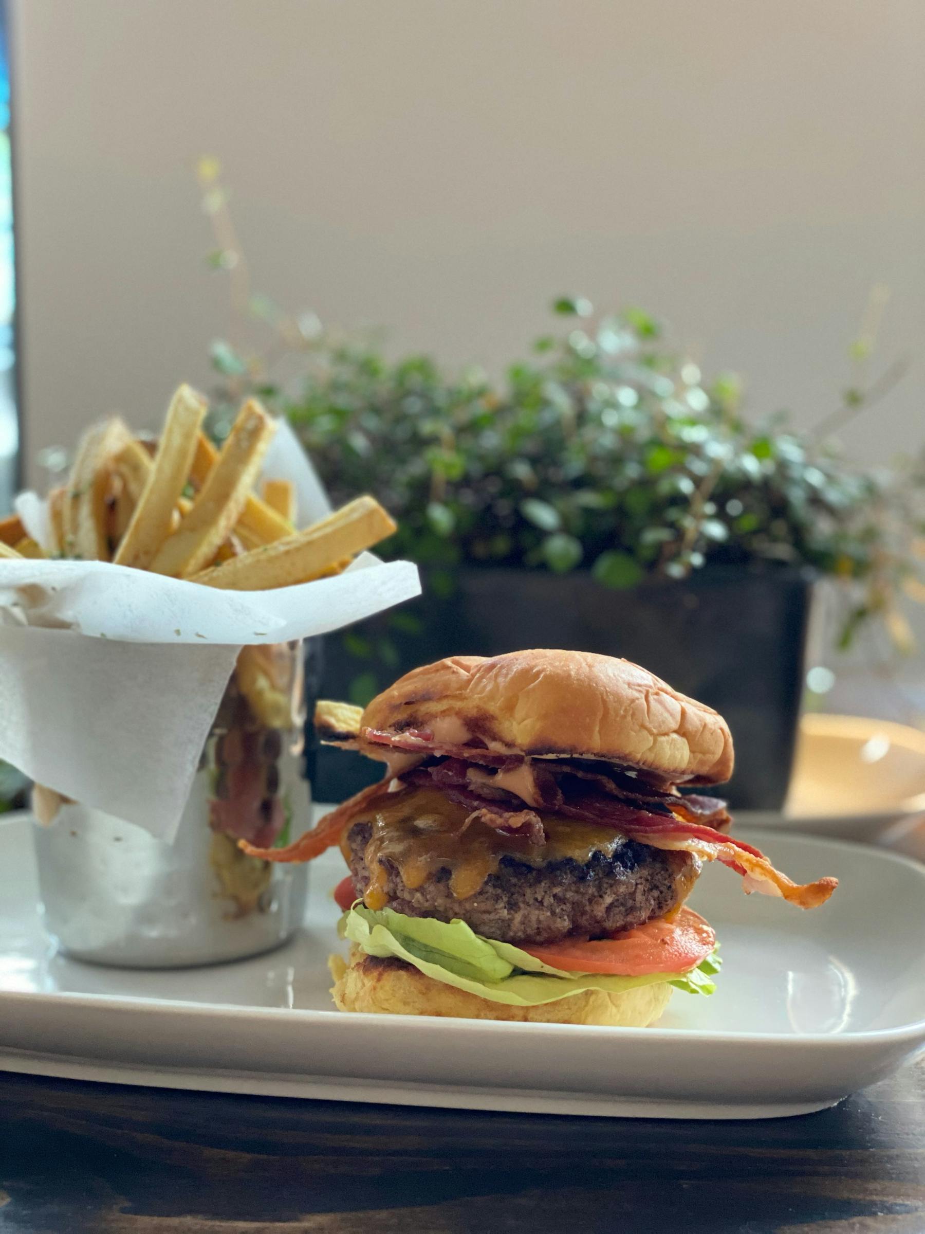 a burger and fries on a plate