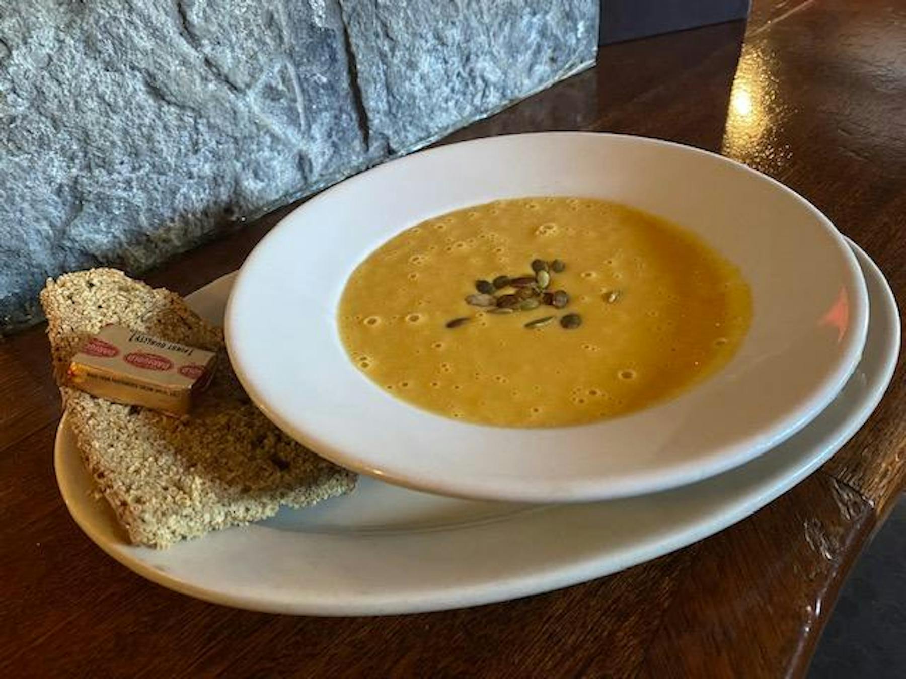 a plate of food and a cup of coffee