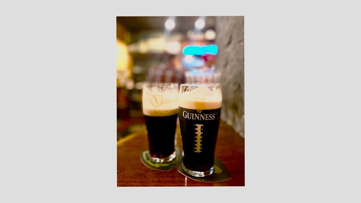 a glass of beer on a table